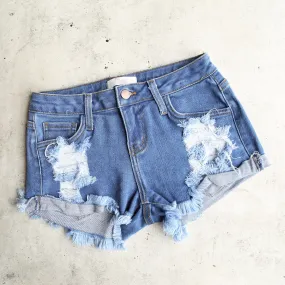 Low Rise Fitted Cut Off Distressed Shorts in Mid Wash Denim